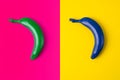 Green and blue bananas on pink and yellow background