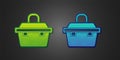 Green and blue Case or box container for wobbler and gear fishing equipment icon isolated on black background. Fishing