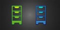 Green and blue Chest of drawers icon isolated on black background. Vector