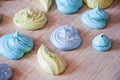 Green and blue color candy. meringue top view background. sea shell dessert. trendy french cookies flat lay. whipped egg white swe Royalty Free Stock Photo