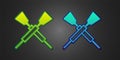 Green and blue Crossed oars or paddles boat icon isolated on black background. Vector Royalty Free Stock Photo