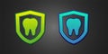 Green and blue Dental protection icon isolated on black background. Tooth on shield logo. Vector Royalty Free Stock Photo