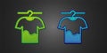 Green and blue Drying clothes icon isolated on black background. Clean shirt. Wash clothes on a rope with clothespins