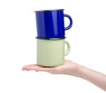 Green and blue enamel cup in hand