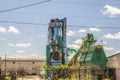 A green and blue industrial plant