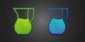 Green and blue Jug glass with water icon isolated on black background. Kettle for water. Glass decanter with drinking Royalty Free Stock Photo