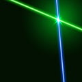 Green and blue laser beams isolated on dark background. Royalty Free Stock Photo