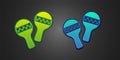 Green and blue Maracas icon isolated on black background. Music maracas instrument mexico. Vector Royalty Free Stock Photo