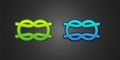 Green and blue Nautical rope knots icon isolated on black background. Rope tied in a knot. Vector Royalty Free Stock Photo
