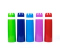 Green, blue, pink and red thermos bottles on white background Royalty Free Stock Photo