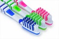 Green, blue and pink toothbrushes are isolated on a white Royalty Free Stock Photo