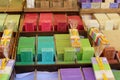 Green blue purple yellow and red soap at a farmer market in France, Europe. Italian hand made soap. Street French market at Nice.