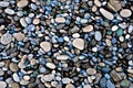Green blue rocks on a beach (background, wallpaper) Royalty Free Stock Photo