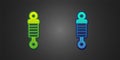 Green and blue Shock absorber icon isolated on black background. Vector Royalty Free Stock Photo