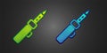 Green and blue Soldering iron icon isolated on black background. Vector