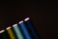 green and blue threads with black background Royalty Free Stock Photo