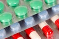 Green, blue and white-and-red antibiotic capsules