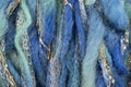 Green and blue wool threads with golden and silver threads Royalty Free Stock Photo