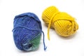 Green blue and yellow ball of wool yarn for knitting close up on a white background