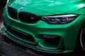 Green BMW M3 F80 car wrapped in chrome vinyl wrap, custom wide body kit with carbon fiber parts and front