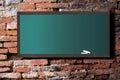 Green board on old wall Royalty Free Stock Photo