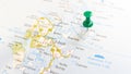 A green board pin stuck in the island of stronsay on a map of Scotland Royalty Free Stock Photo