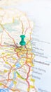 A green board pin stuck in Newcastle Upon Tyne on a map of England portrait Royalty Free Stock Photo