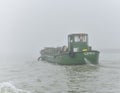 Green Boat and Foggy Day