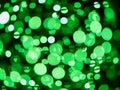 Green bokeh background. Irish luck color theme. Random round shape