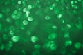 Green bokeh lights background. Unfocused abstract red glitter holiday background. Christmas, Valentines day, St. Patricks Day cele