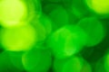 Green bokeh lights vibrant background image.