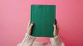 The green book held by hands.AI generated image Royalty Free Stock Photo