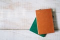 Green books lie on a wooden table. top view. layflat Royalty Free Stock Photo