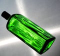 Green bottle of Jagermeister on pink background