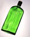 Green bottle of Jagermeister on light background Royalty Free Stock Photo