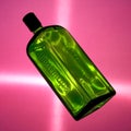 Green bottle of Jagermeister on pink background