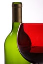 Green bottle, red wine glass Royalty Free Stock Photo