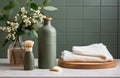 green bottle of shampoo, towel, wooden brushes, and herbs in a white ceramic bathroom Royalty Free Stock Photo