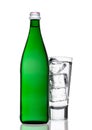 Green bottle of sparkling mineral water with glass Royalty Free Stock Photo