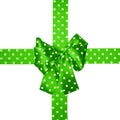 Green bow and ribbon with white polka dots made from silk Royalty Free Stock Photo