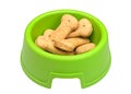 Green bowl of bone-shaped dog biscuits Royalty Free Stock Photo