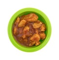 Green bowl with chicken chunks in barbecue sauce Royalty Free Stock Photo