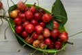 Green bowl of fresh and juice cherries Royalty Free Stock Photo