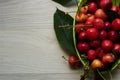 Green bowl of fresh and juice cherries Royalty Free Stock Photo