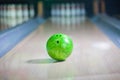 Green Bowling ball put on alley Royalty Free Stock Photo