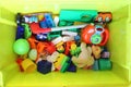 Green box with children`s toys Royalty Free Stock Photo