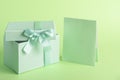 Green box with gift bow and card to write whatever you want