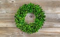 Green Boxwood Leaf Wreath on Rustic Wood Royalty Free Stock Photo