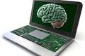 Green brain on laptop keyboard symbolizing AI integration digital learning systems neural network technologies in innovative