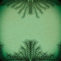 Green branches forming a frame on an old paper texture